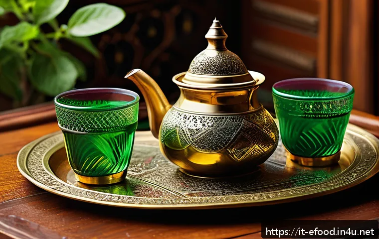 모로코 민트차 만들기 - A traditional Moroccan tea setting featuring a polished brass teapot with intricate engravings, pour...